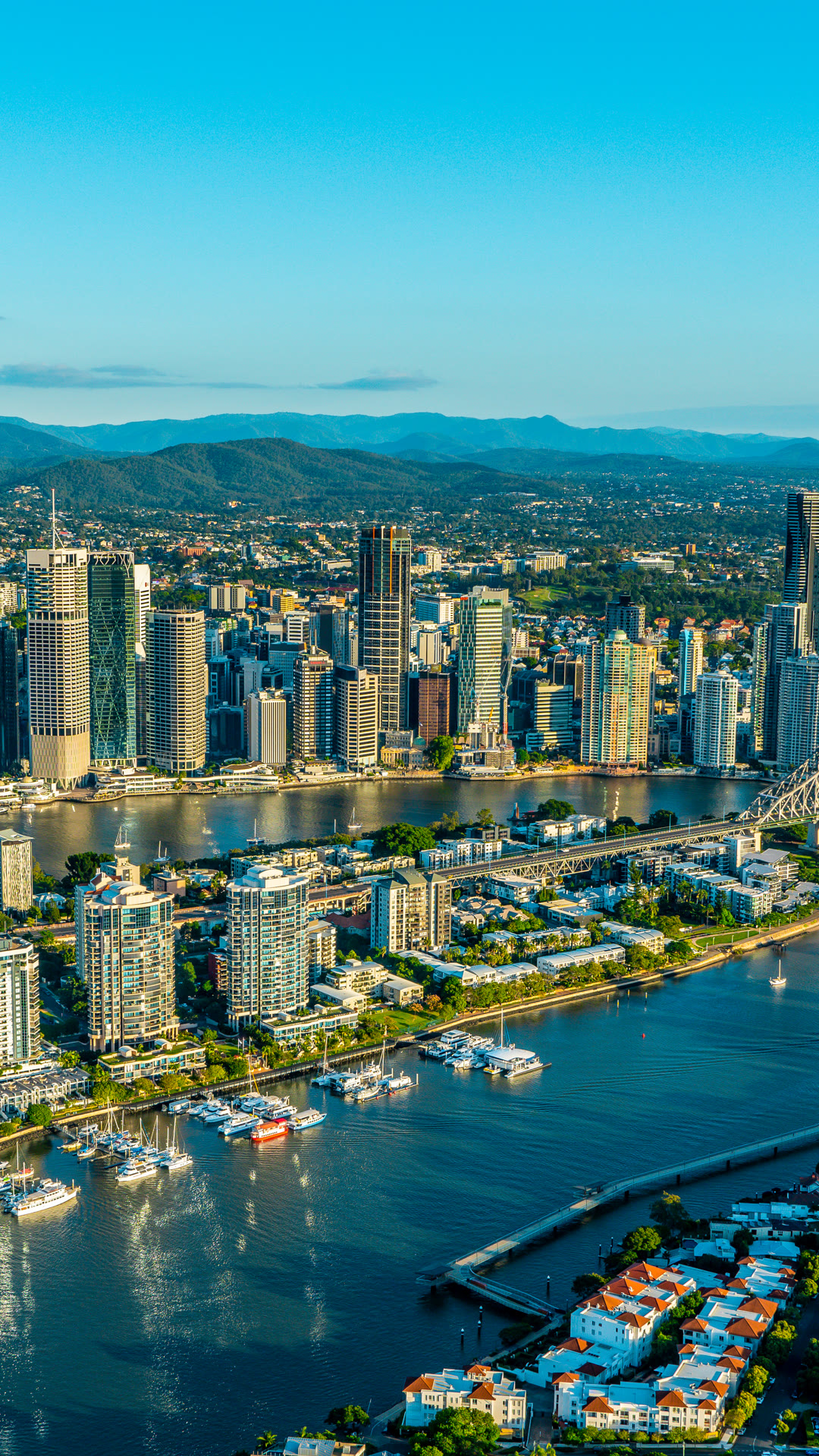 Aerial view of Gold Coast waterways, towers and hinterland.