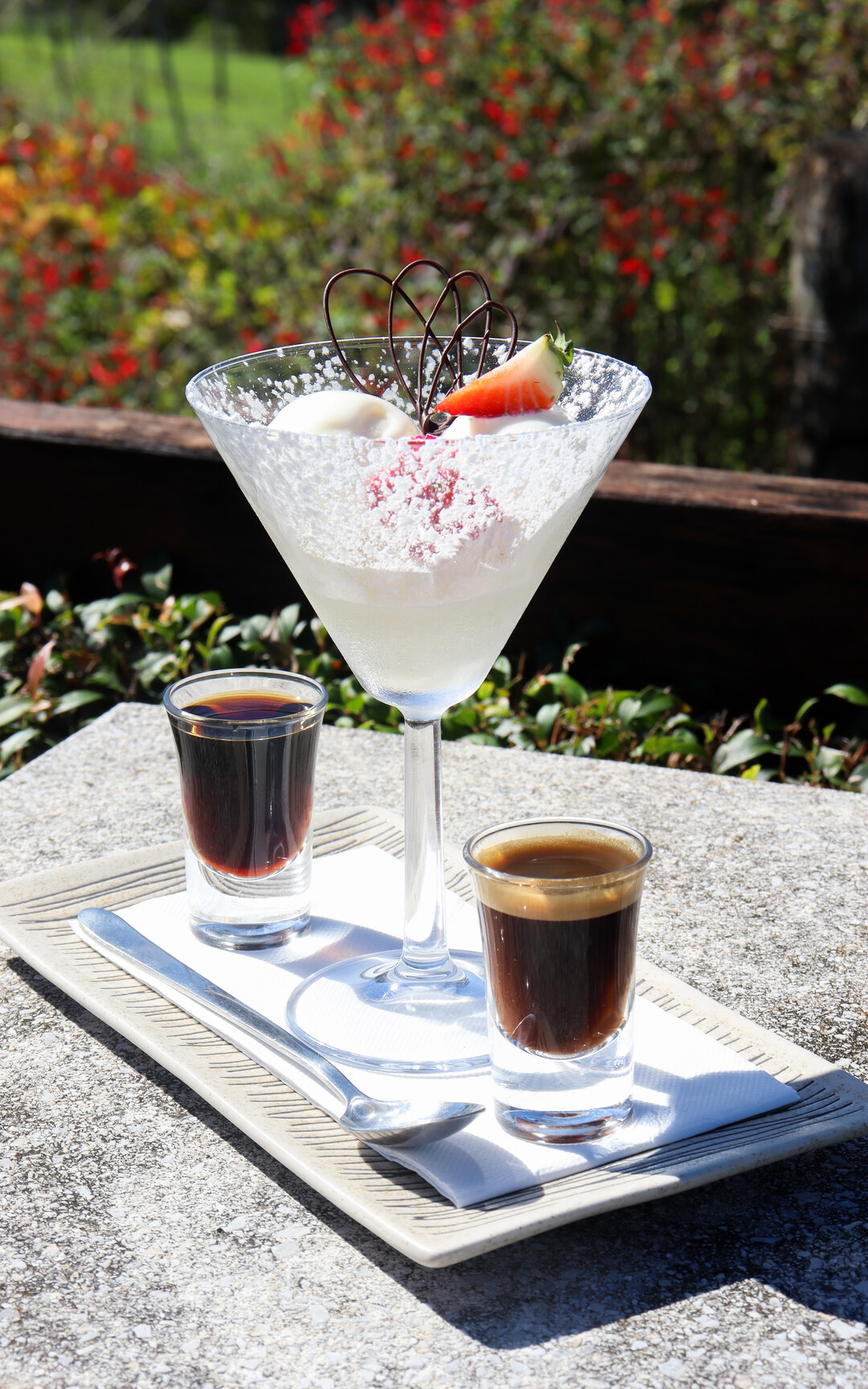 Dessert and coffee served in the gardens at Flaxton Gardens.