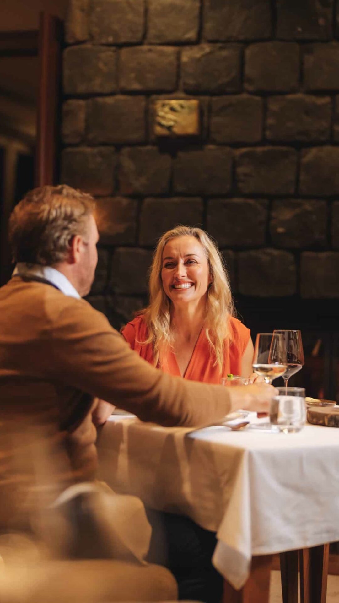 Couple dining inside Spicers Peak Lodge.