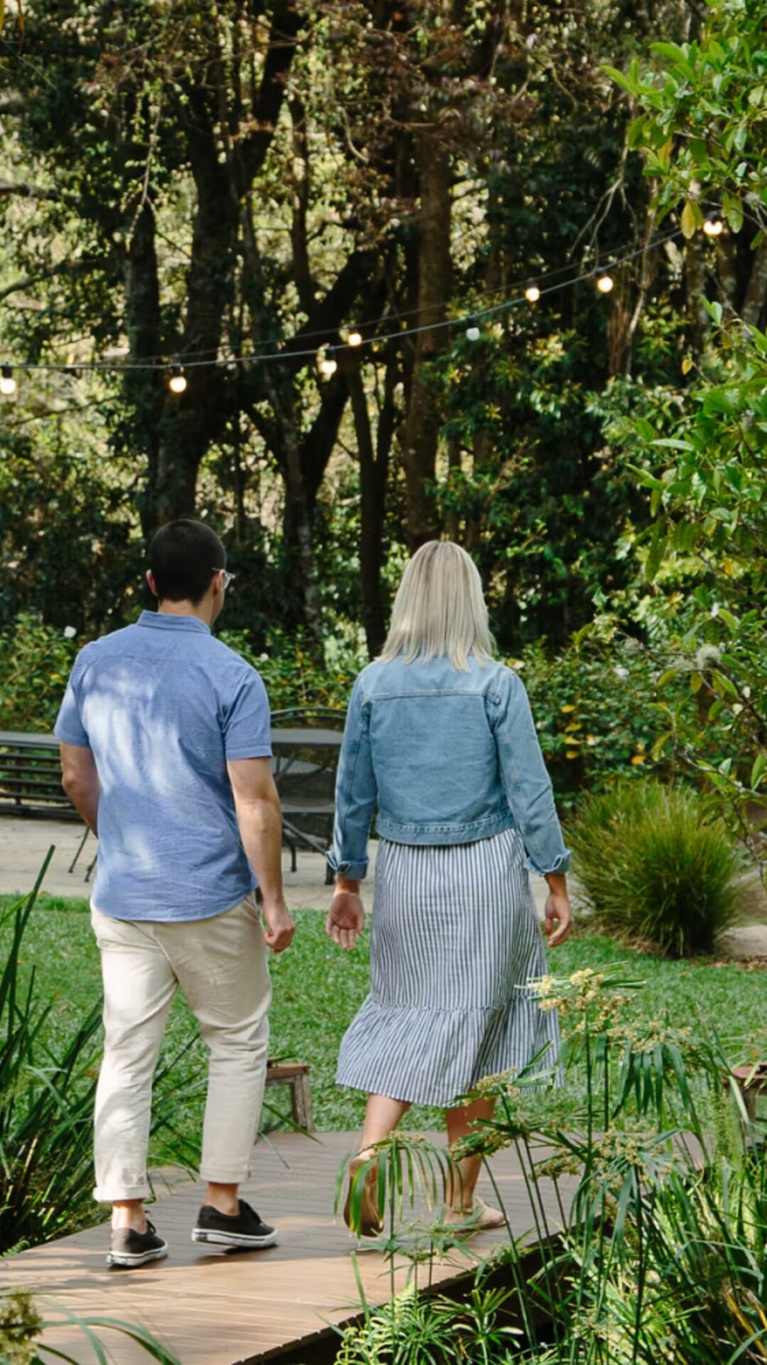 Guests walking through the rainforest garden at Spicers Tamarind.