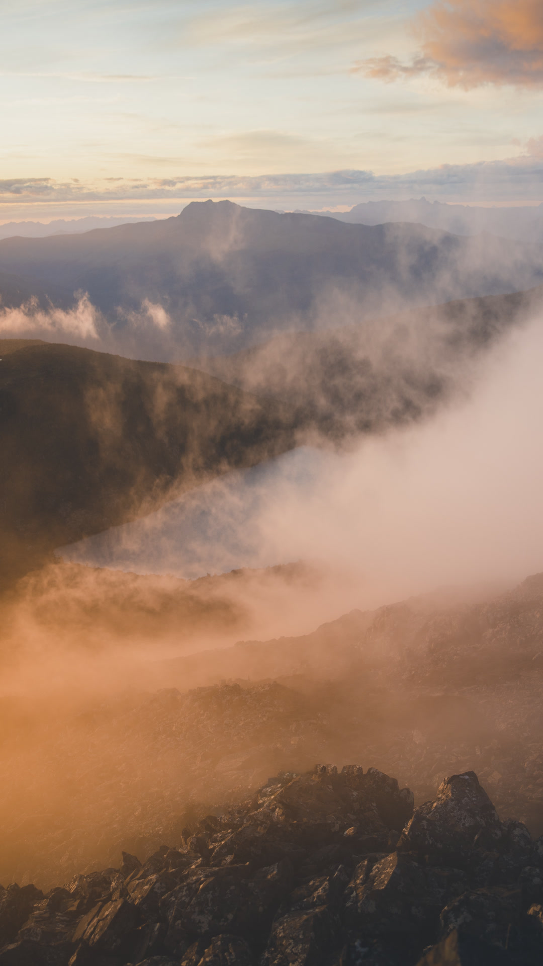 Morning cloud and mountain ridges at sunrise.