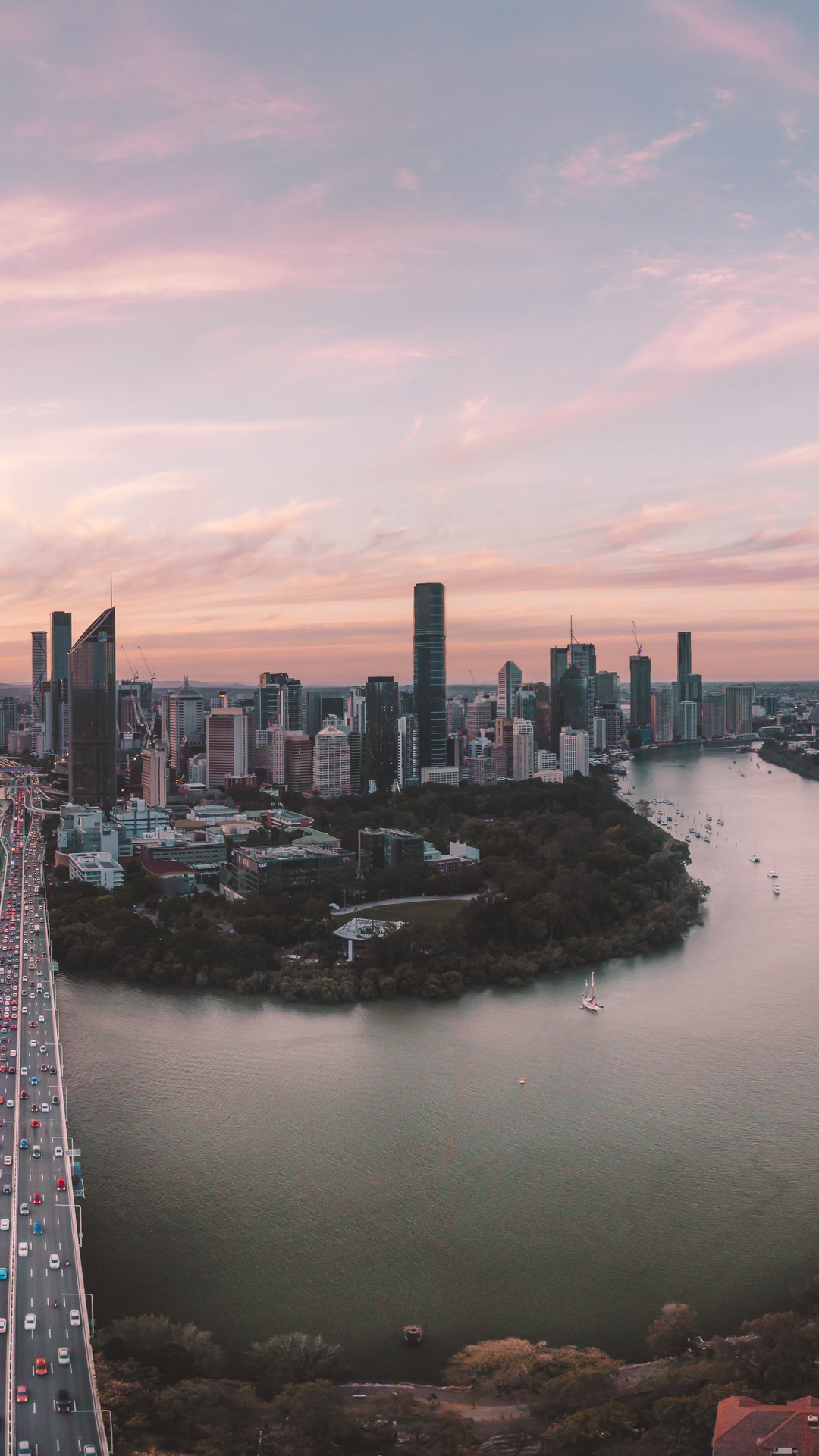 Brisbane River and city skyline at sunrise.