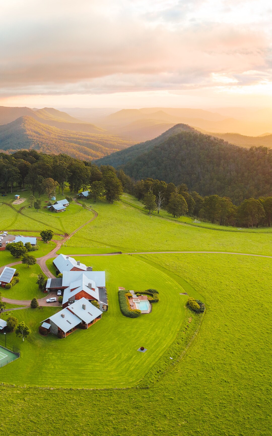 Aerial panorama of Spicers Peak Lodge at sunset.