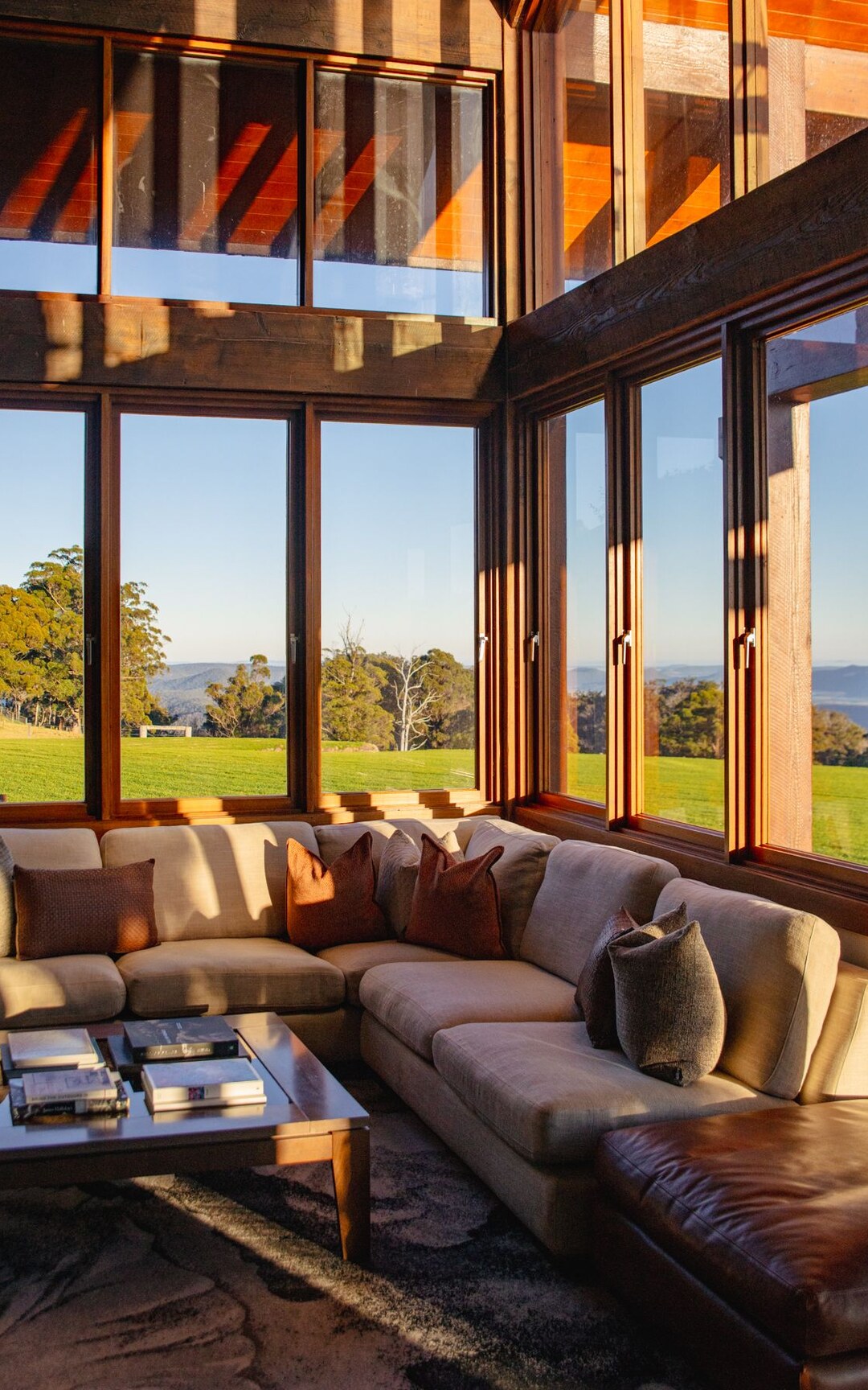 Sunlit lounge overlooking the grounds at Spicers Peak Lodge.