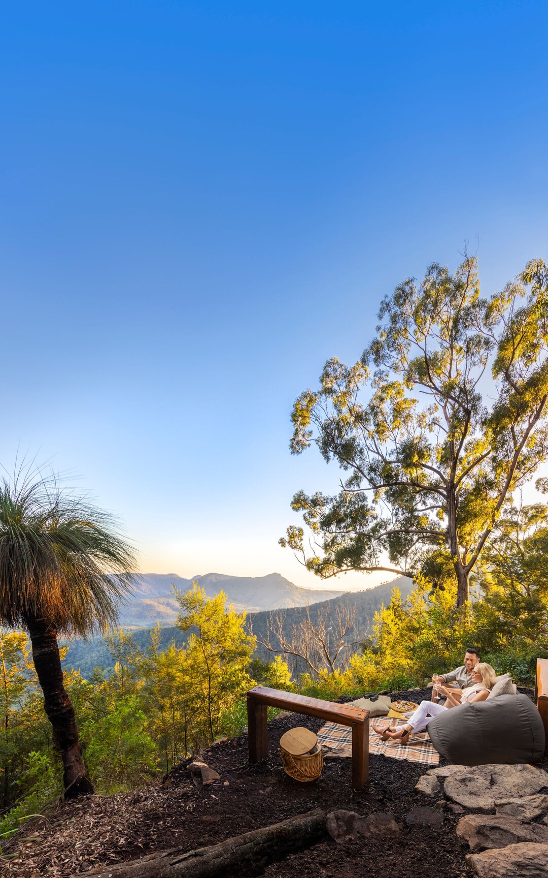 Couple enjoying a private picnic with mountain views at Spicers Peak Lodge.