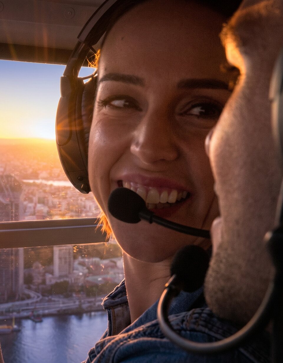 Passenger enjoying a sunset helicopter flight over Brisbane