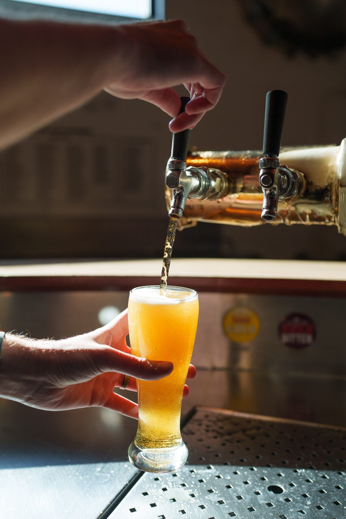 Bartender pouring beer at a country pub stop