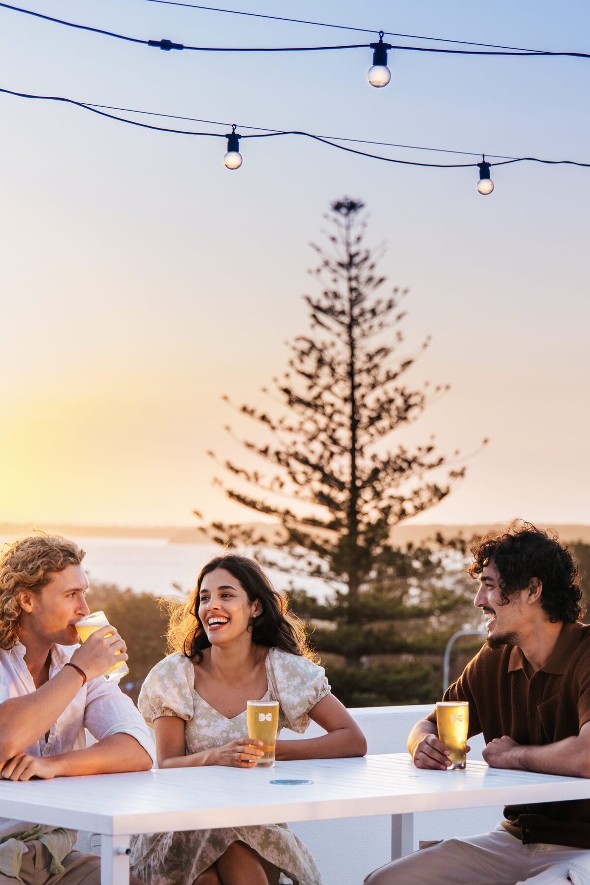 Friends enjoying drinks at Straddie Brewing Co. in Dunwich
