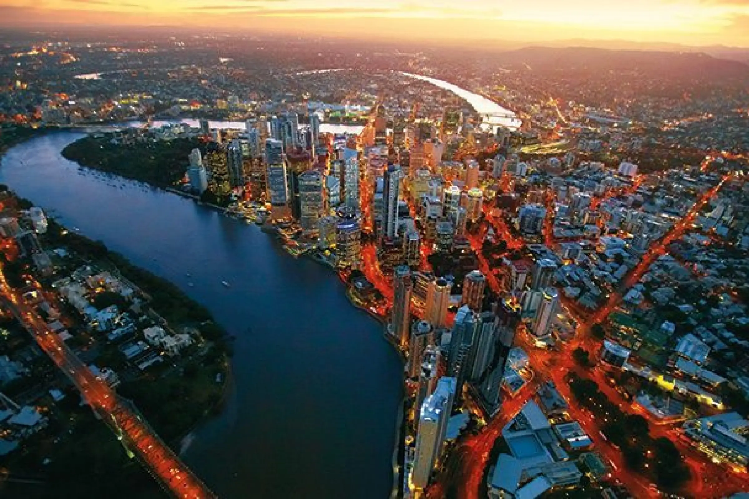 Brisbane city aerial at sunset.