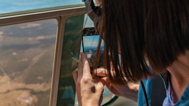 Taking a photo our of helicopter