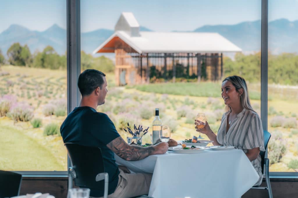 Guests dining with views across Kooroomba Lavender Farm.