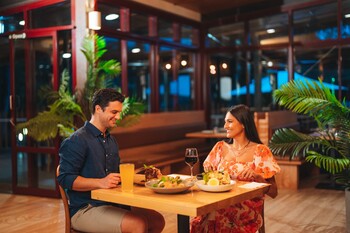 Couple enjoying a meal at Sand and Wood restaurant