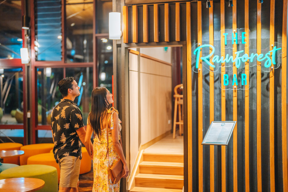 Couple walking into The Rainforest Bar