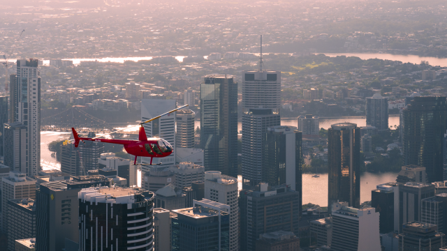 R44 over city pink glow