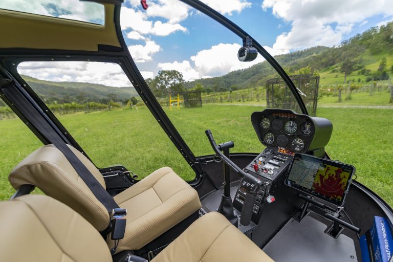 Open-door Robinson R44 cabin configured for an unobstructed view