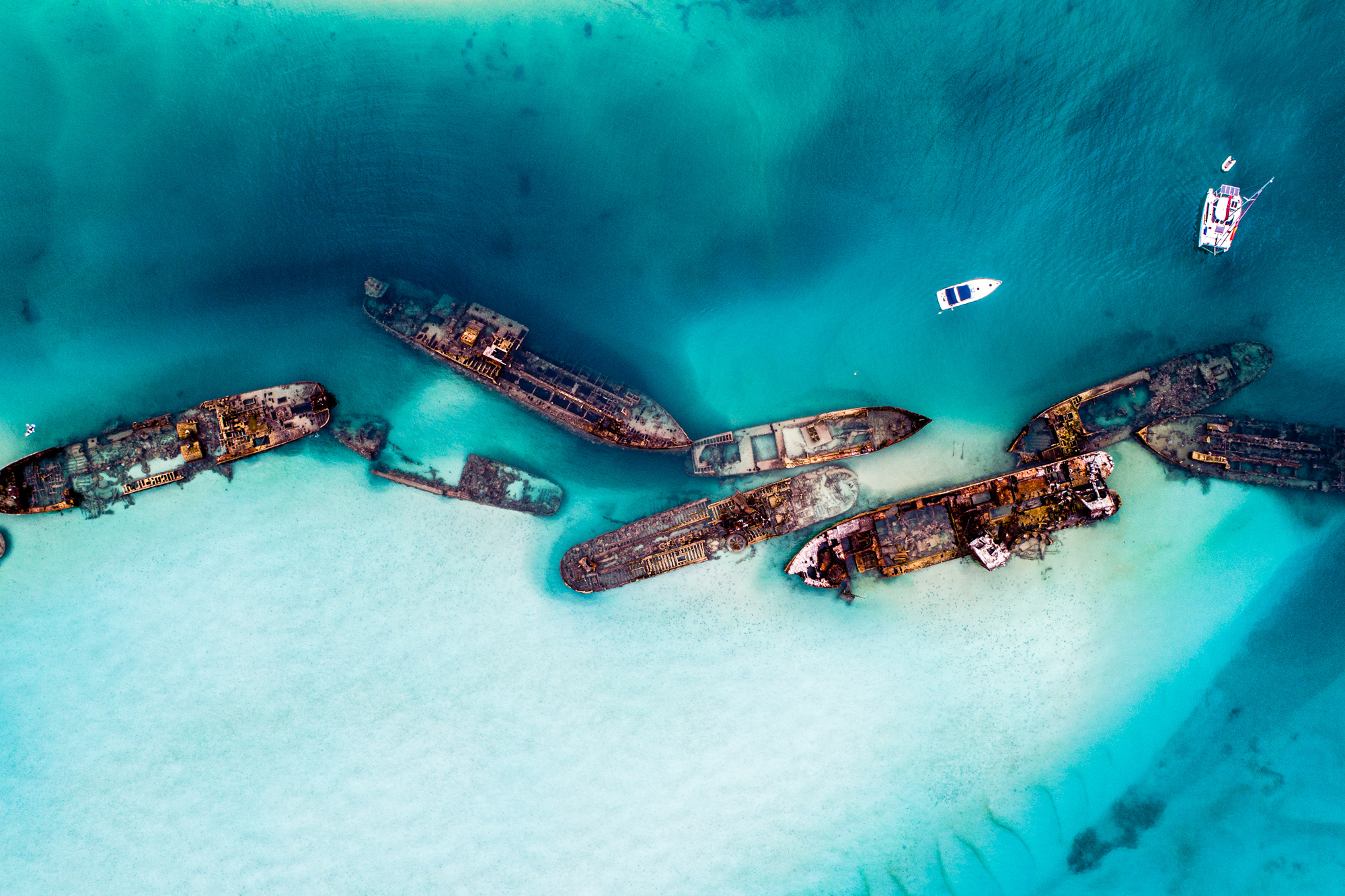 Tangalooma Wrecks in turquoise water.