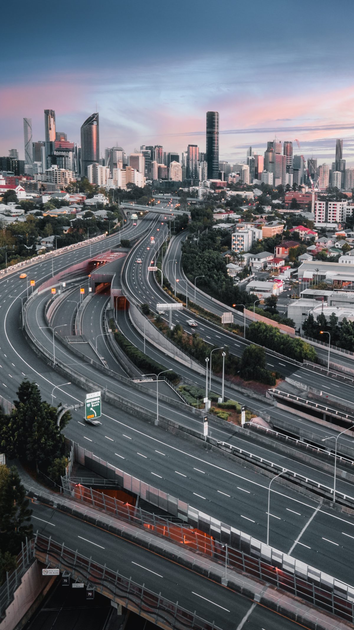 Aerial view of Brisbane roads leading toward the city skyline.