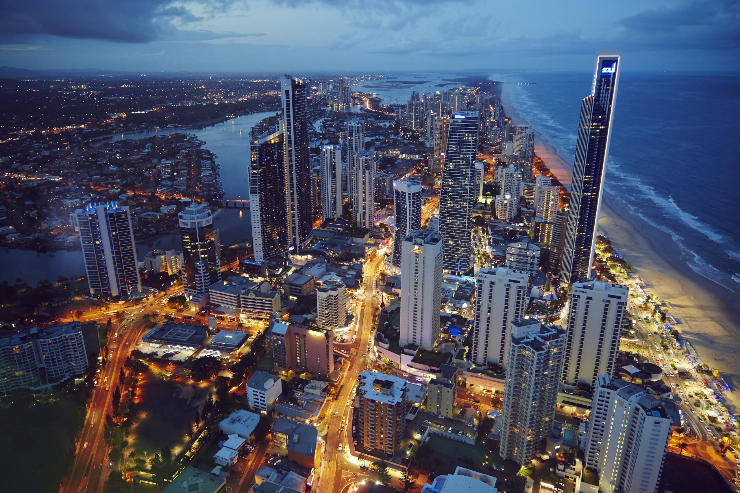 Gold Coast skyline and coastline beside Q1 at dusk.