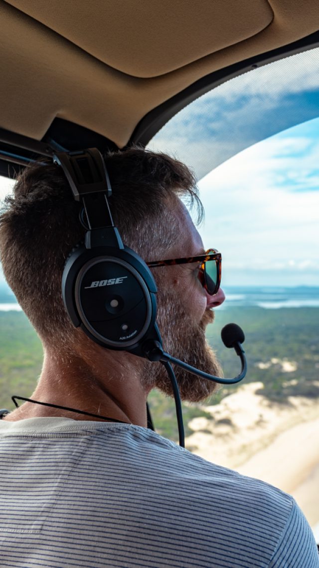 Passenger looking out from the helicopter during the Wine and Stein route.