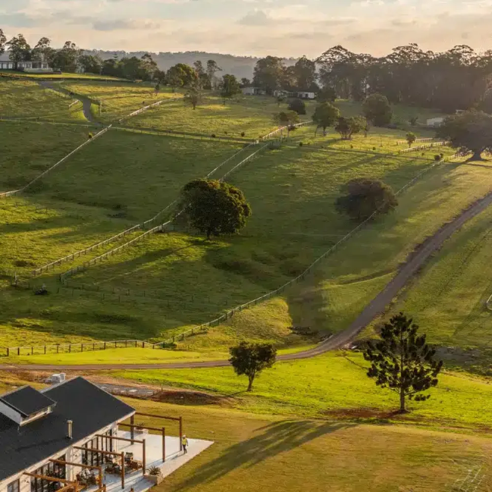Golden-hour view across Beechmont Estate accommodation and restaurant.