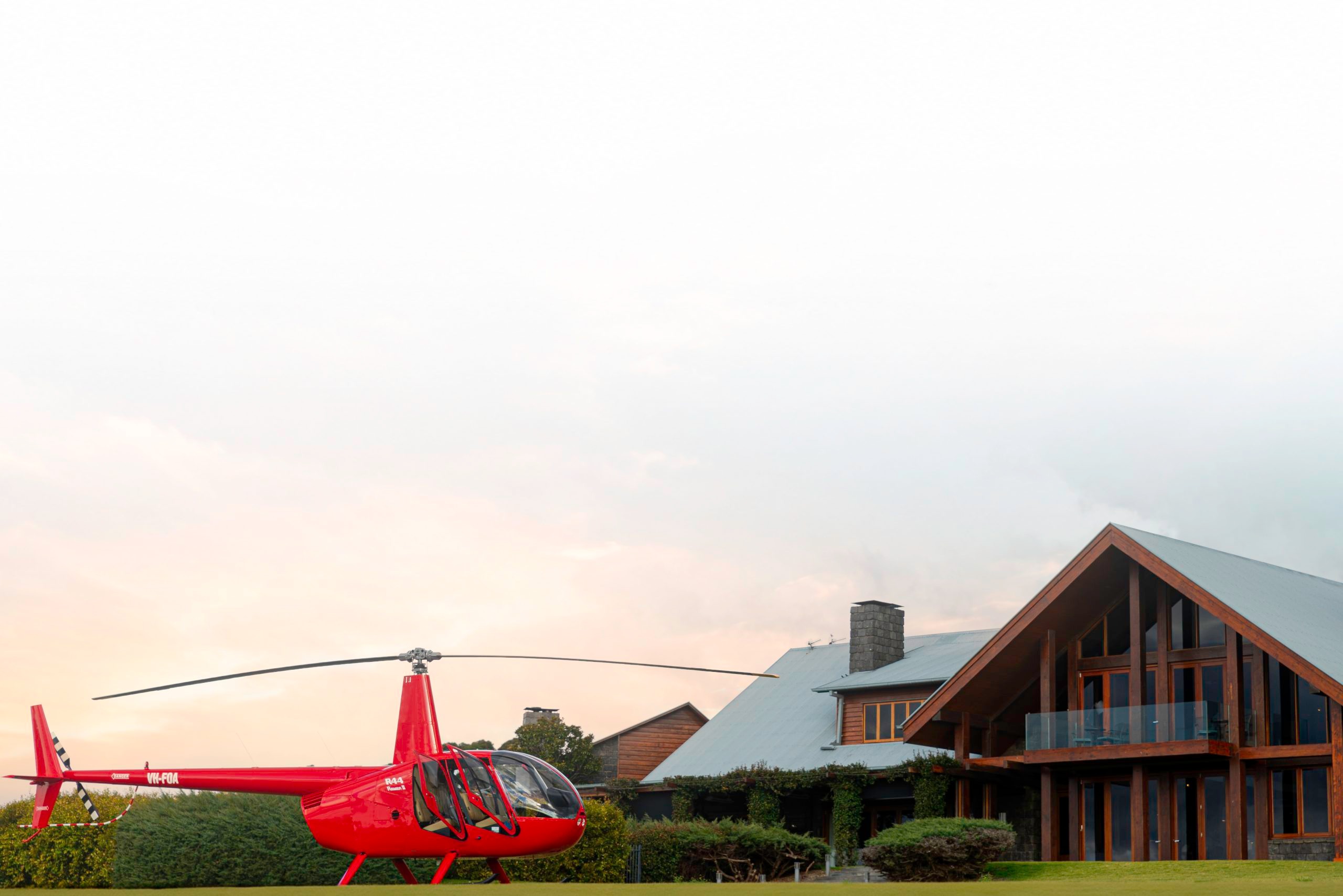 Bekaa Air helicopter beside a high-altitude lodge