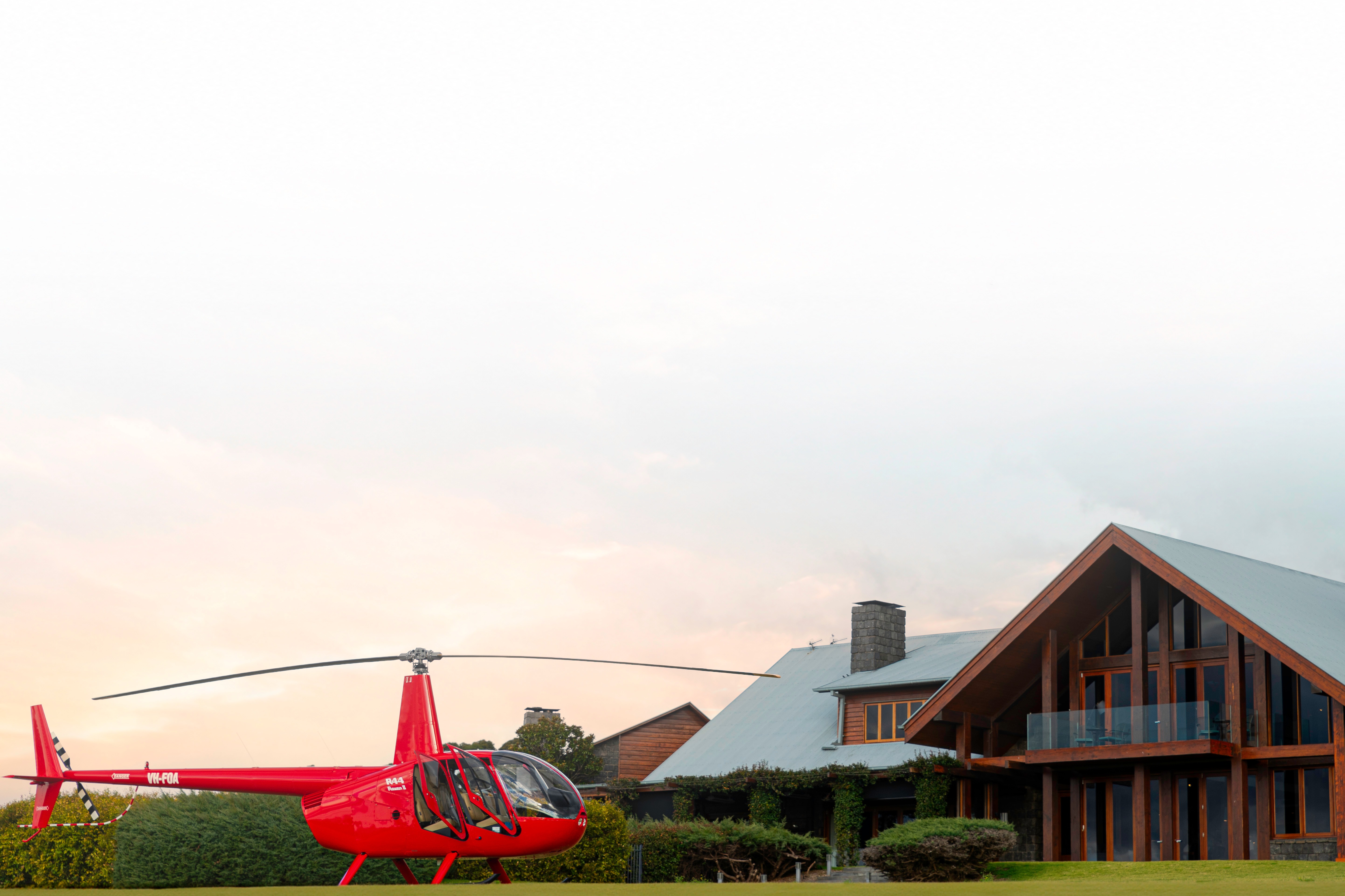 Bekaa Air helicopter beside a high-altitude lodge