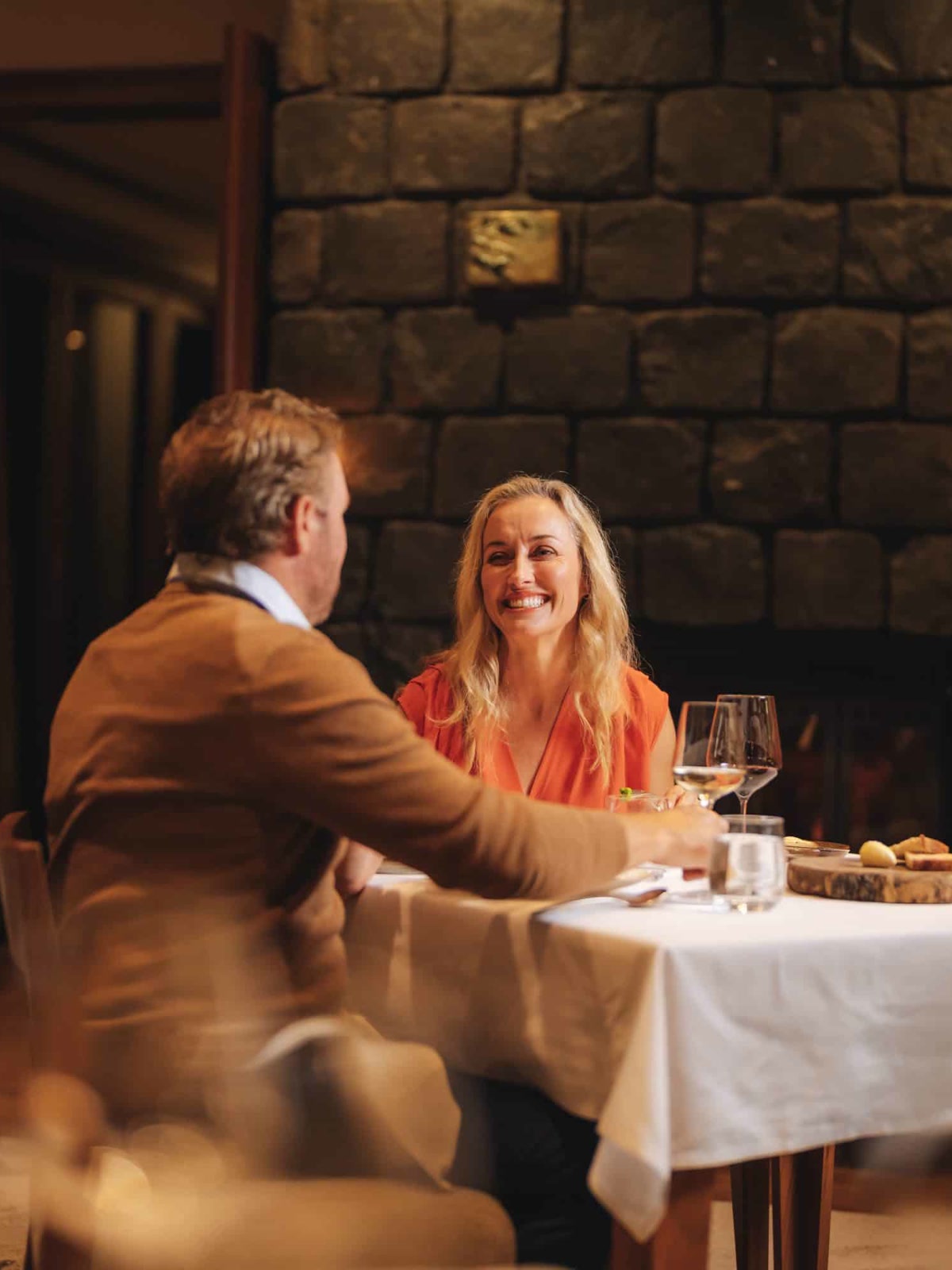 Couple dining inside Spicers Peak Lodge.