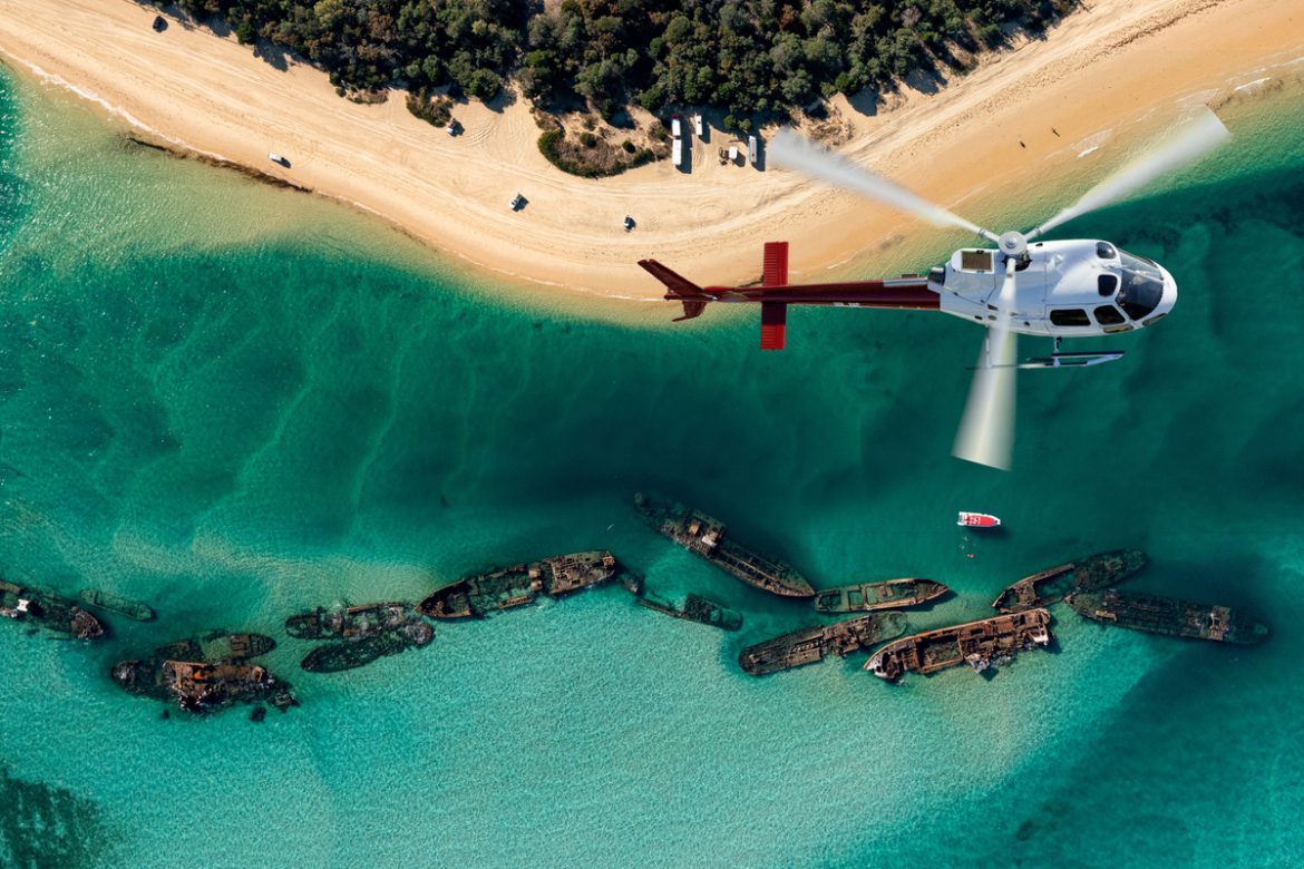 Helicopter cockpit over Moreton Bay coastline