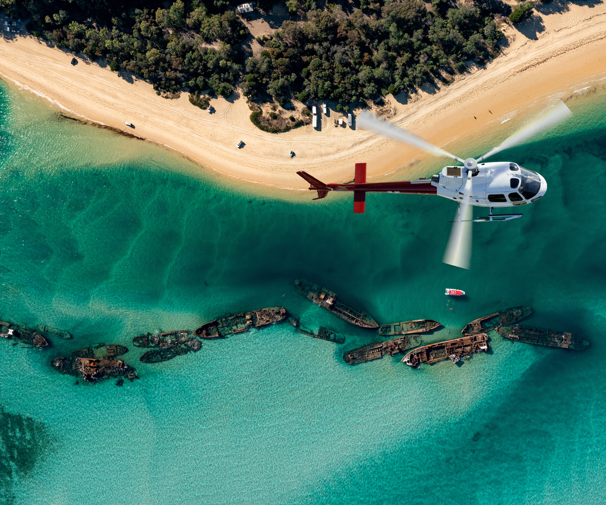 Helicopter cockpit over Moreton Bay coastline