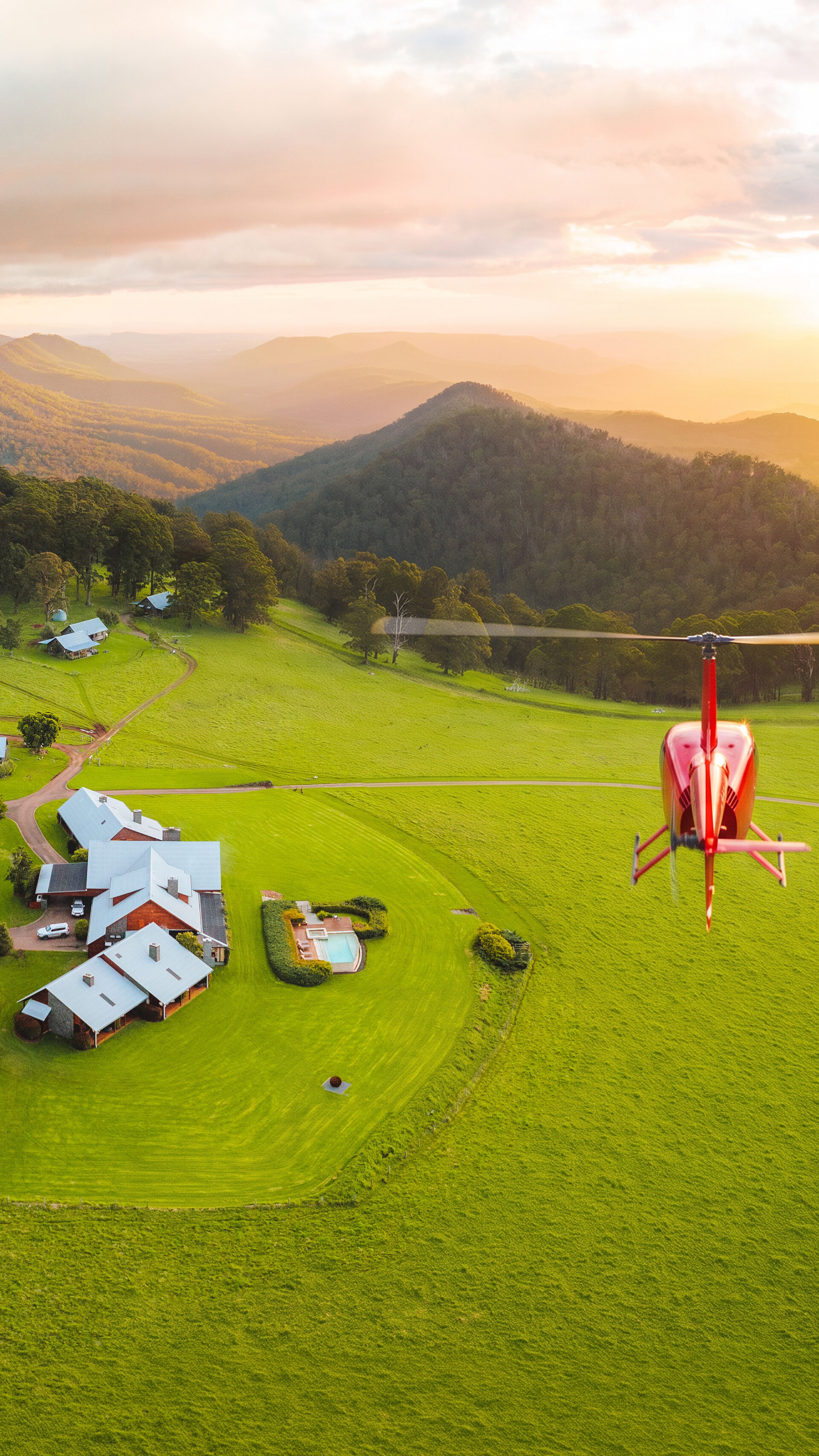 Bekaa Air helicopter approaching Spicers Peak Lodge at sunset