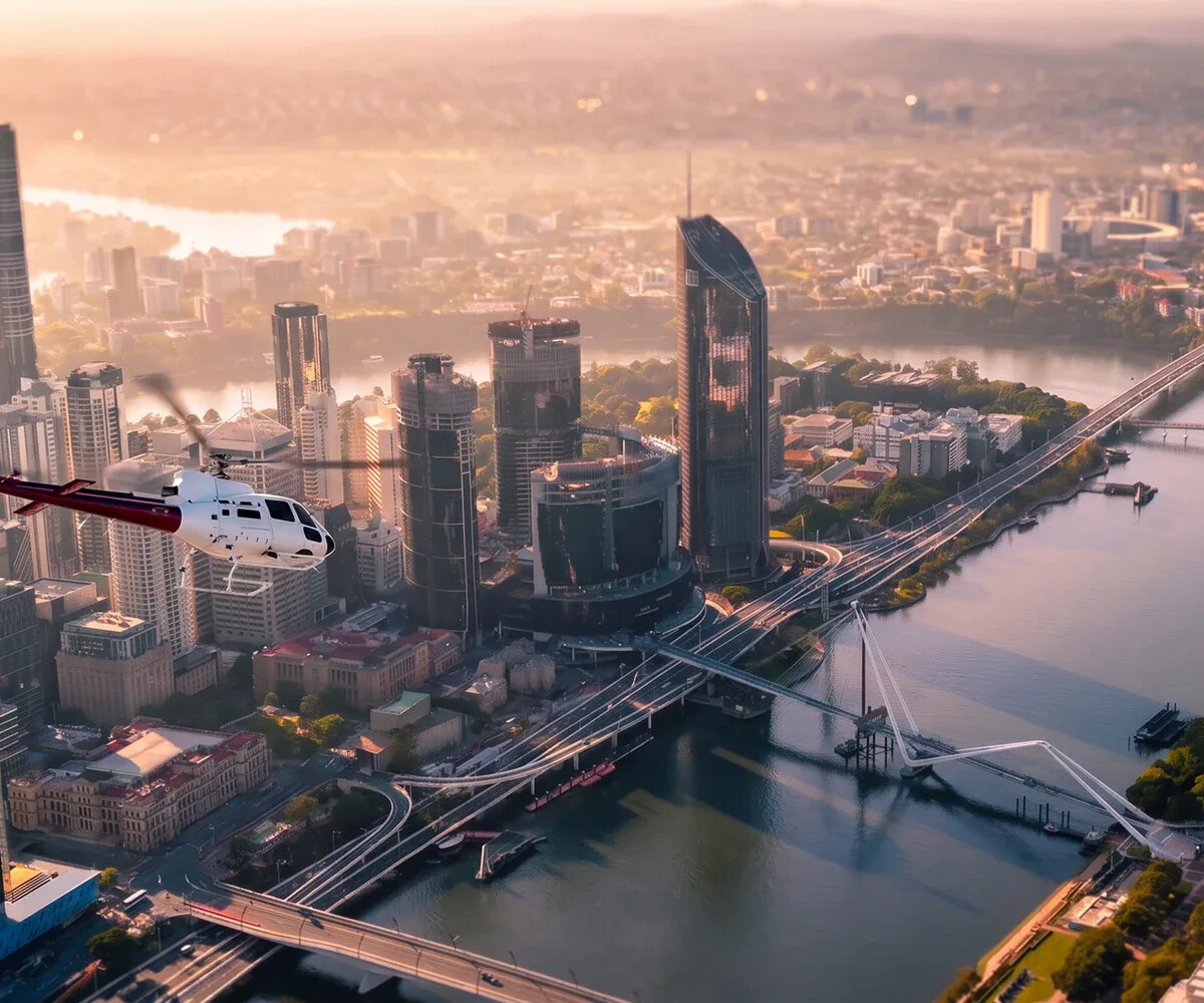 Brisbane skyline and Bekaa Air helicopter at golden hour