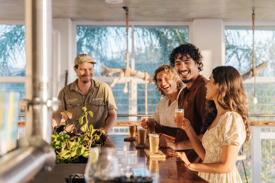 Friends enjoying drinks together at Straddie Brewing Co.