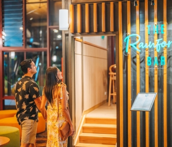 Couple walking into The Rainforest Bar